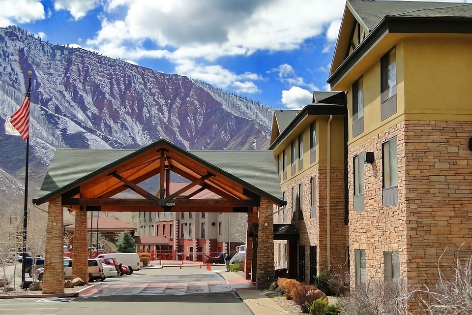 Pull up under the covered entry with mountain views.