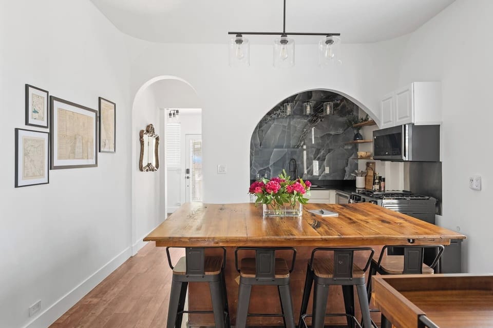 A stylish gourmet kitchen equipped with premium appliances and a spacious island perfect for cooking and gathering.