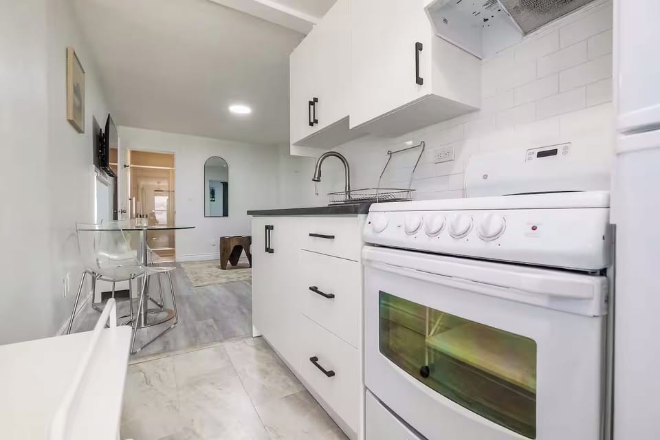 Functional kitchen layout with stove, oven, and prep space