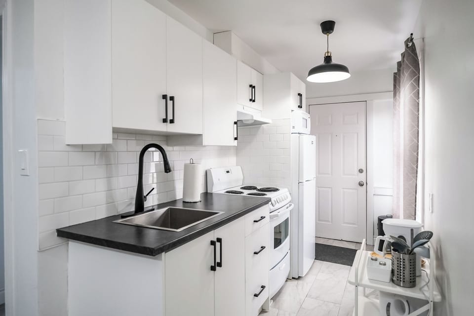 Modern kitchen with sleek finishes, full-size appliances, and everything needed 