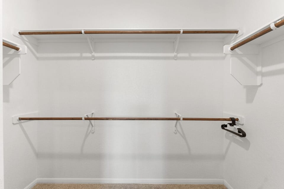 Organize belongings in a spacious walk-in closet