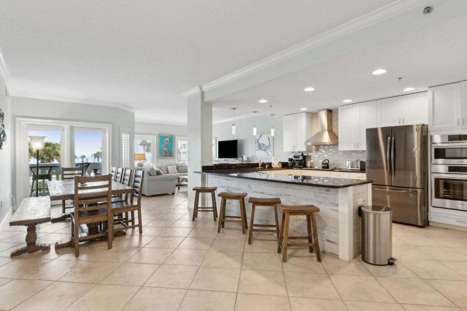 Dine, chat, and gather in the oversized dining space with bar seating