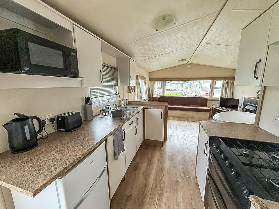 Bright, modern kitchen with spacious dining and lounge area