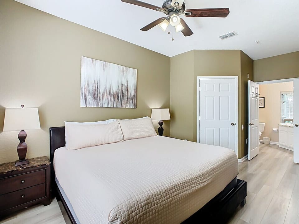Relax in the spacious master suite featuring a king bed, ensuite bathroom, and elegant furnishings.