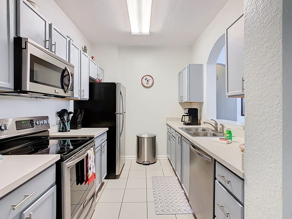 Cook with ease in the fully equipped modern kitchen featuring stainless steel appliances, plenty of space, and everything you need for family favorites or quick snacks.