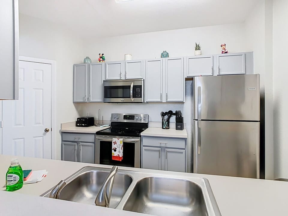 Cook with ease in the fully equipped modern kitchen featuring stainless steel appliances, plenty of space, and everything you need for family favorites or quick snacks.