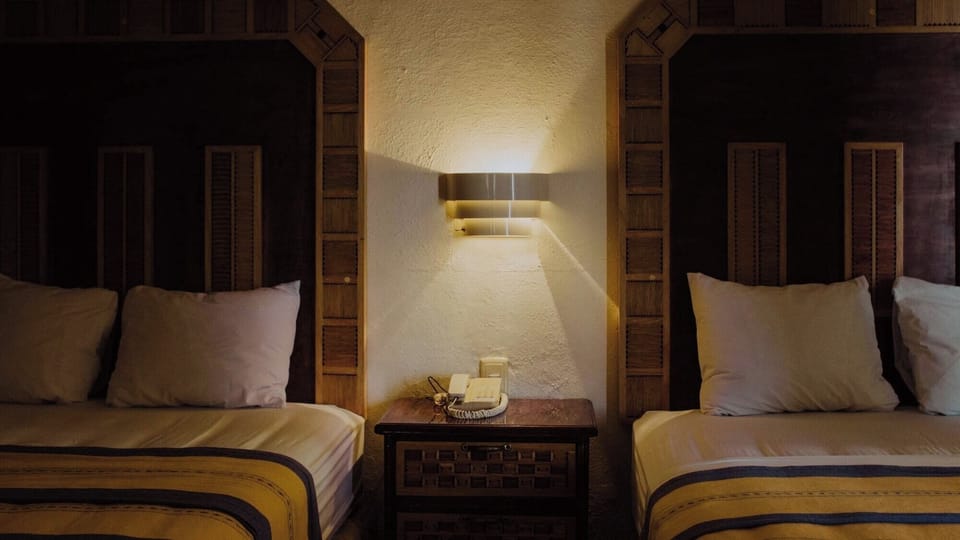 Rest easy with comfortable pillows and quiet bedside ambiance.