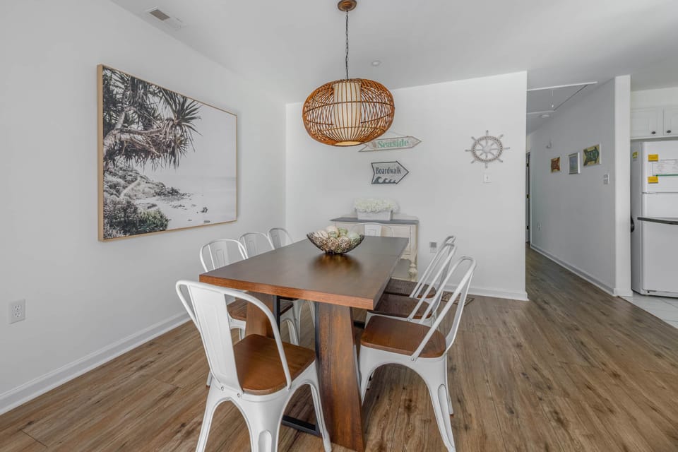A spacious dining room with a table for 8!