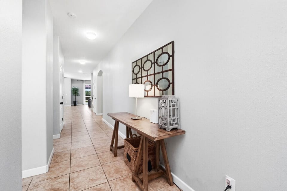 Bright hallway with console table and lamp