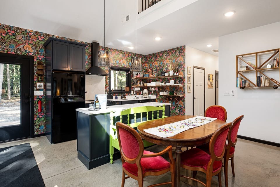 Spacious kitchen-dining area w/ bold design details & plenty of room to cook & connect.