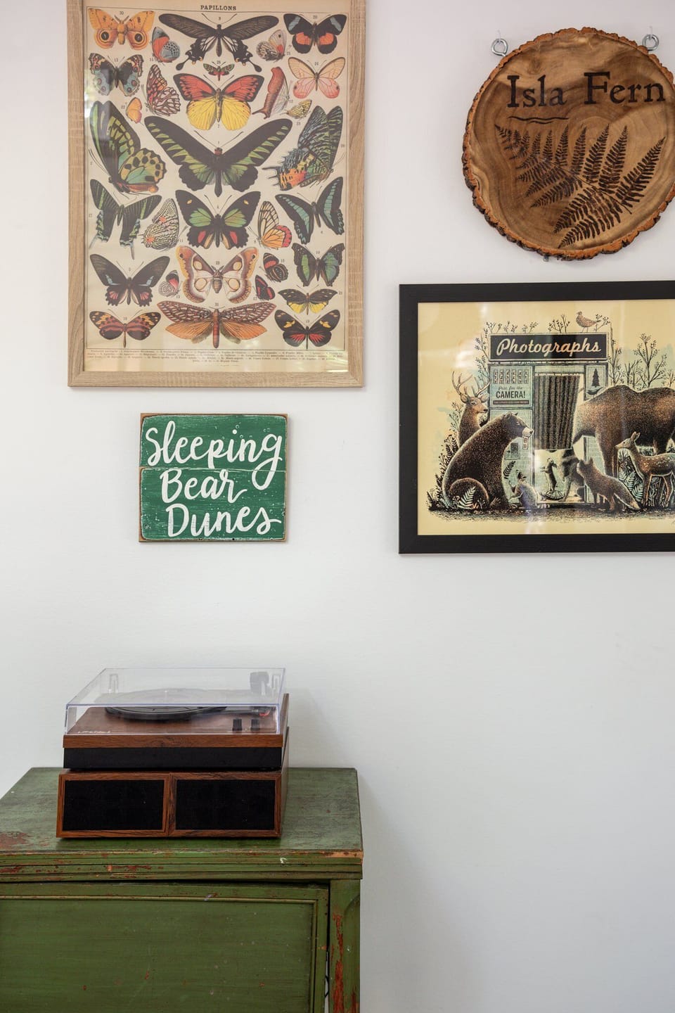 Curated wall art & vintage record player add warmth & personality to the space.