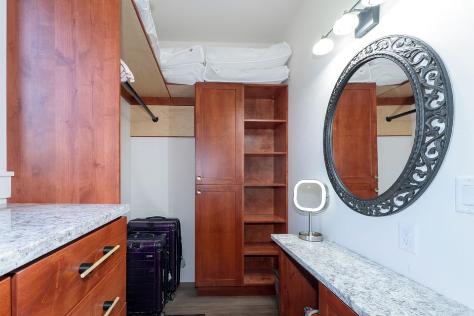 Wrapping up the primary bedroom is this beautiful walk-in closet with ample space and a private vanity to prepare for the day | Main Level