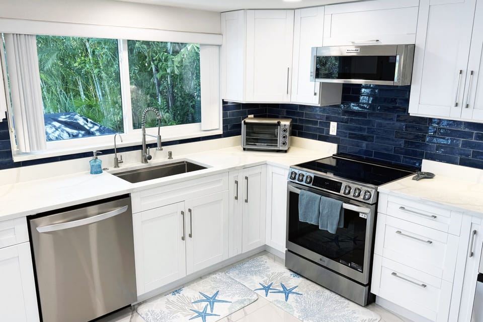 Dishwasher, Electric Stovetop Range, Microwave, toaster oven, Large deep sink.