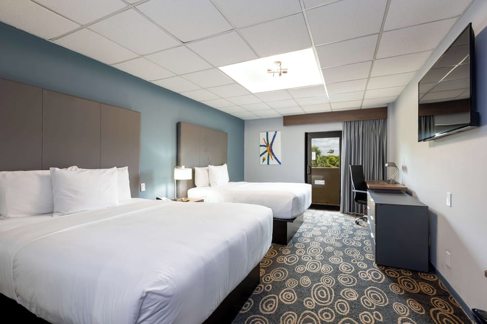 Relax with a roomy layout, TV viewing, and easy desk access.