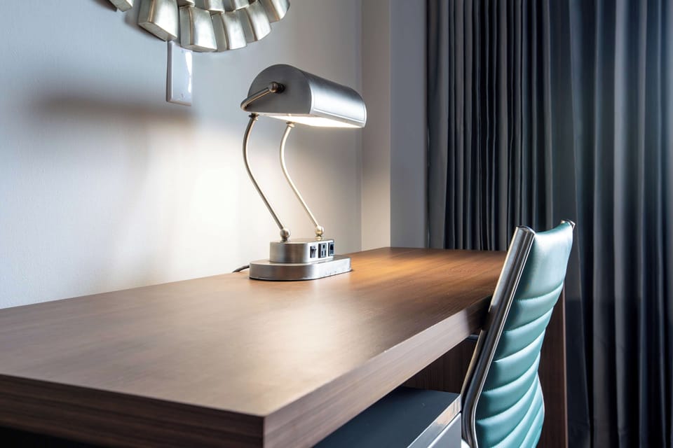 Catch up on emails at a sleek, well-lit workspace.