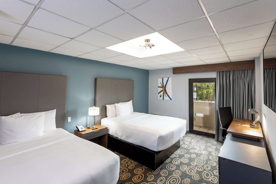 Sleep soundly with two plush beds and calming blue tones.