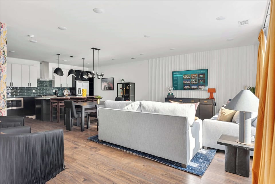 The kitchen flows directly into the living and dining areas so no one feels tucked away while others are gathering