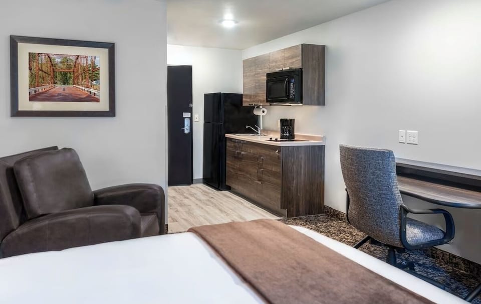 Settle into a spacious studio with kitchenette and comfy seating.