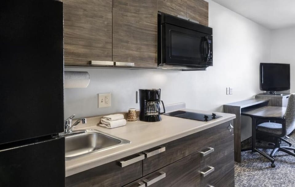 Start mornings with easy kitchenette cooking and a convenient work desk.