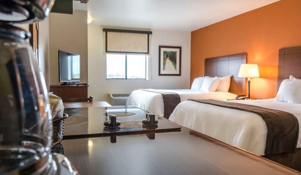Enjoy a studio-style layout with beds and kitchenette in view.