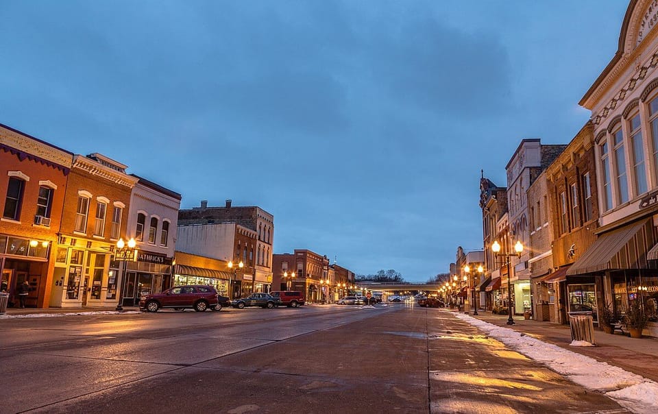 Stroll into lively streetscapes with warm evening lights nearby.