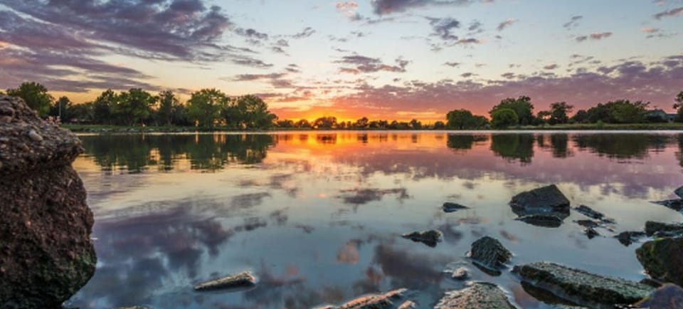 Unwind at sunset with tranquil waters and wide-open skies.