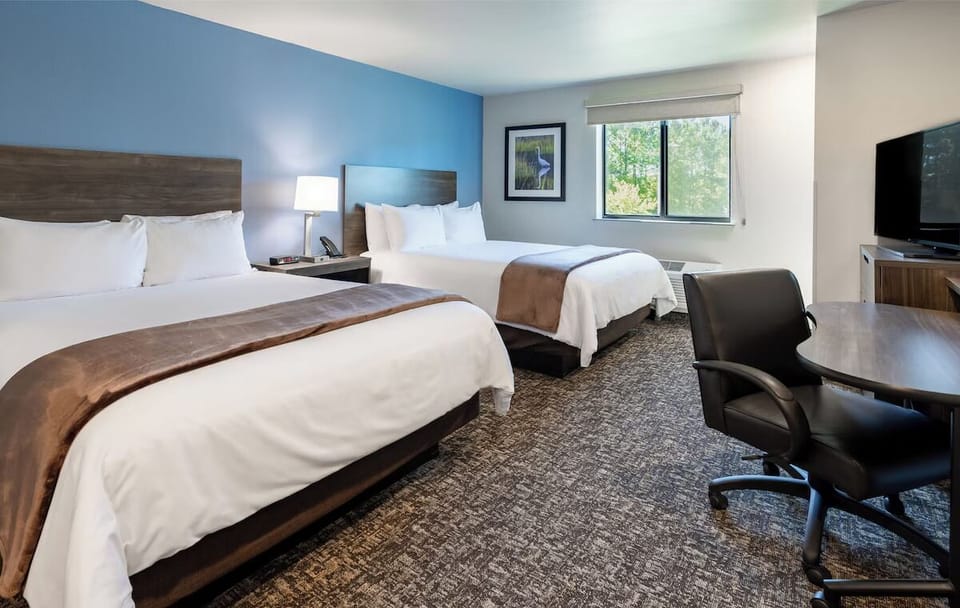 Relax in a bright double-queen room with peaceful views.