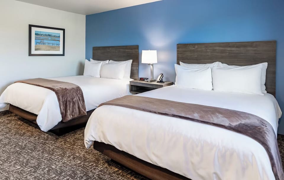 Unwind in crisp double-queen comfort after a full day.