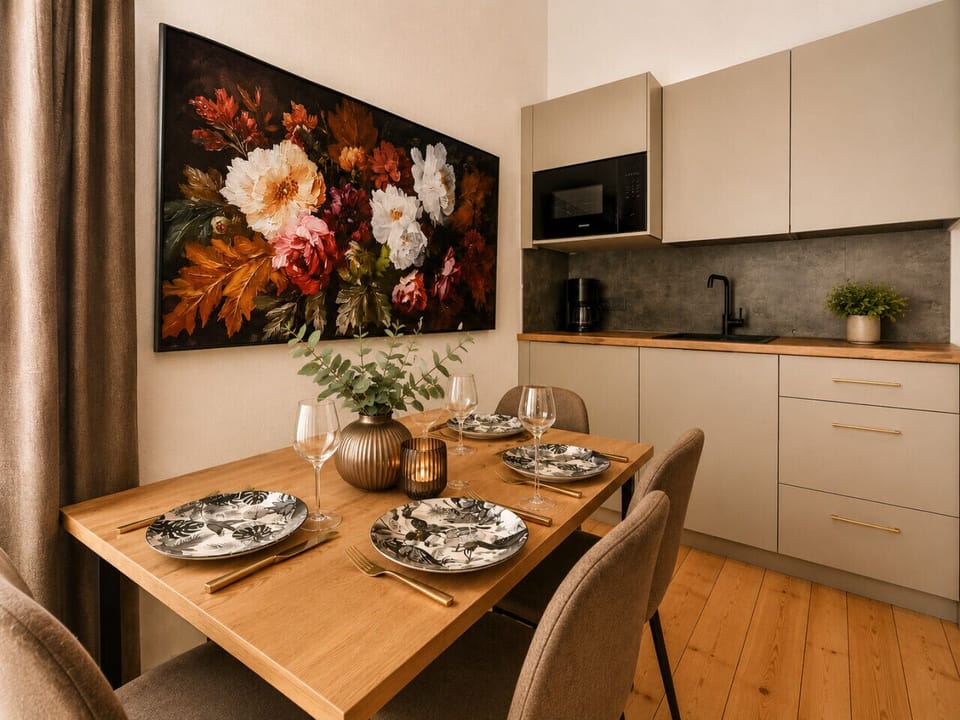 Gather around the dining table and enjoy the convenience of a modern kitchenette equipped with everything you need for preparing meals and snacks during your stay.