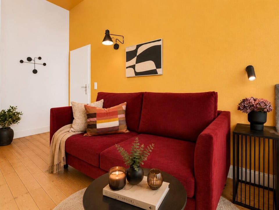 Unwind in this welcoming lounge space with plush seating, contemporary furnishings, and a warm atmosphere designed for comfort and relaxation.