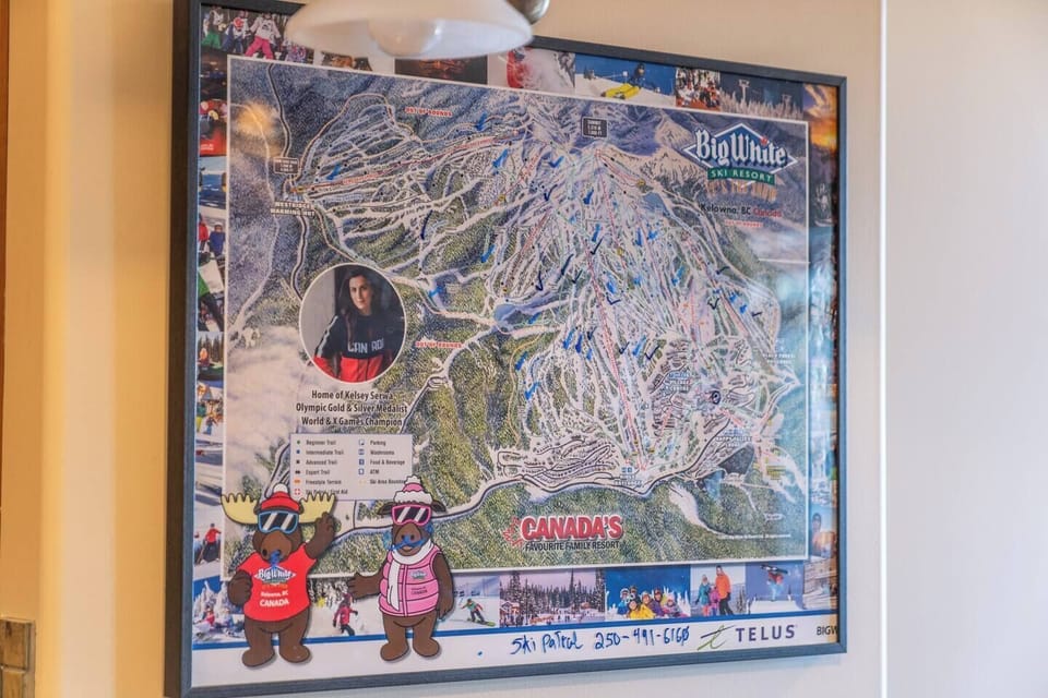 The Big White Ski Resort trail map on the wall showcases the resort's ski runs, lifts, and features, bringing a fun, resort-themed element to the Airbnb's cozy atmosphere.