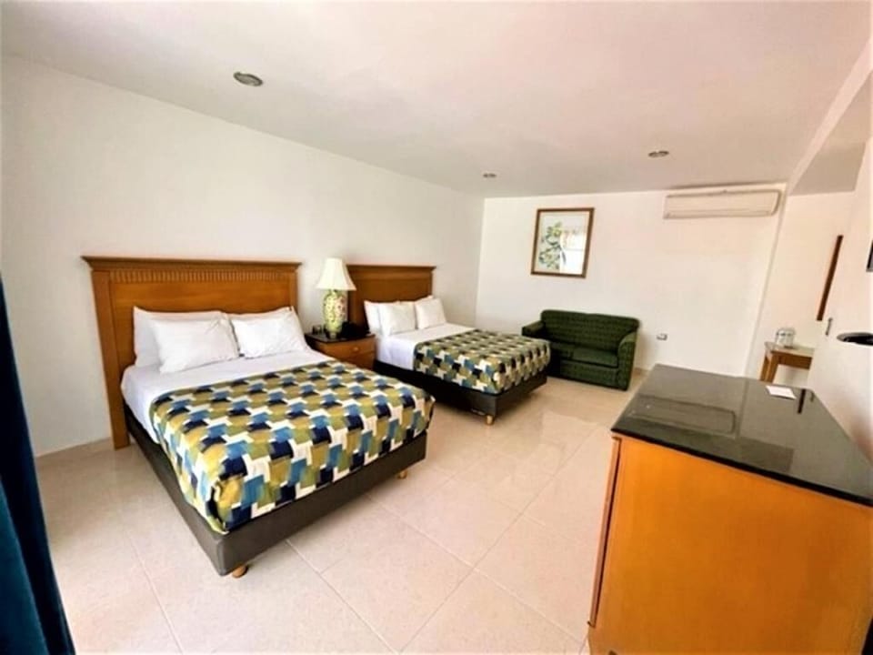 Settle into a roomy retreat with double beds and sofa.