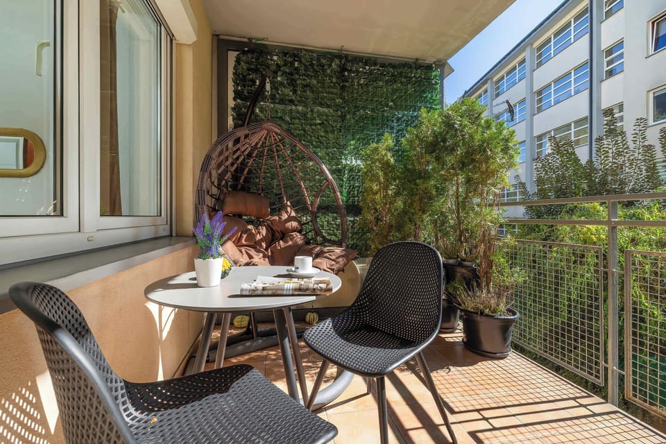 The balcony provides a perfect spot for enjoying the fresh air.