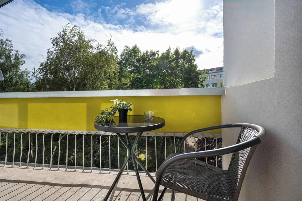 The balcony provides a perfect spot for enjoying the fresh air.
