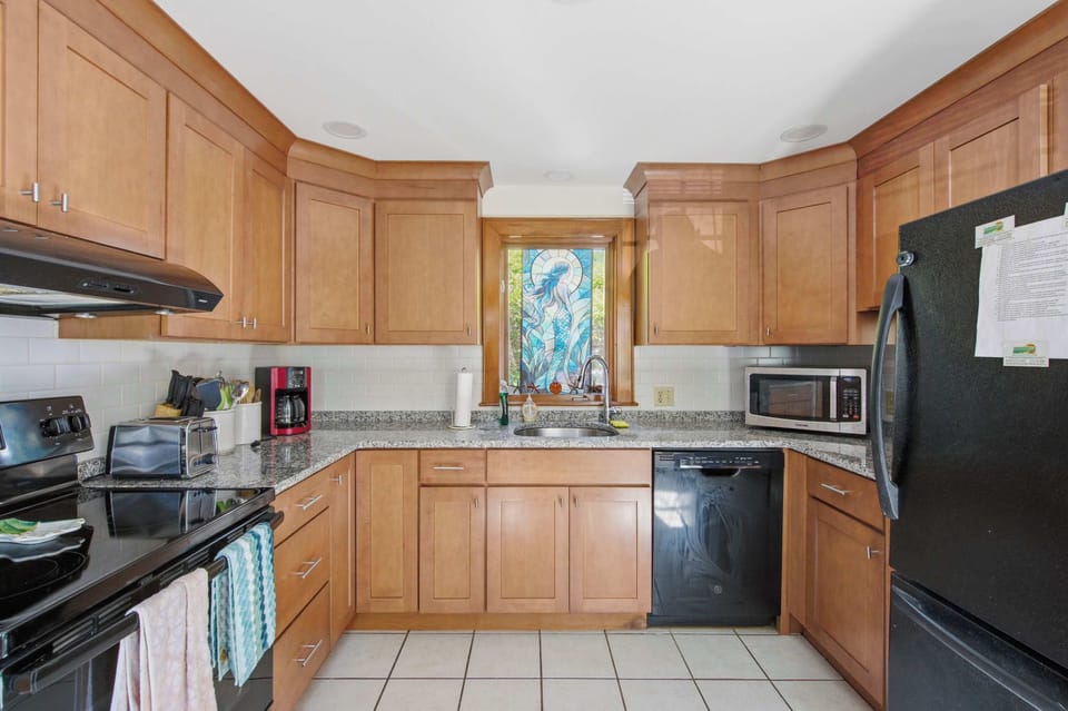 Open kitchen with full appliances for easy vacation meals