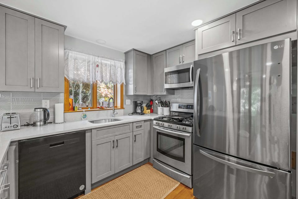Fully equipped kitchen with modern appliances and ample storage