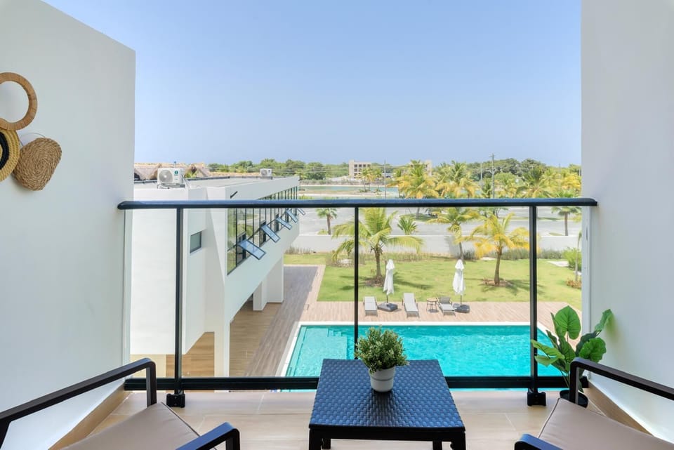 Private balcony with pool views—perfect for morning coffee or evening drinks.