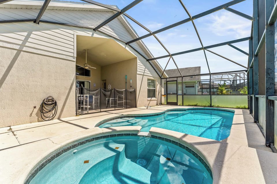 Screened in pool with outdoor seating