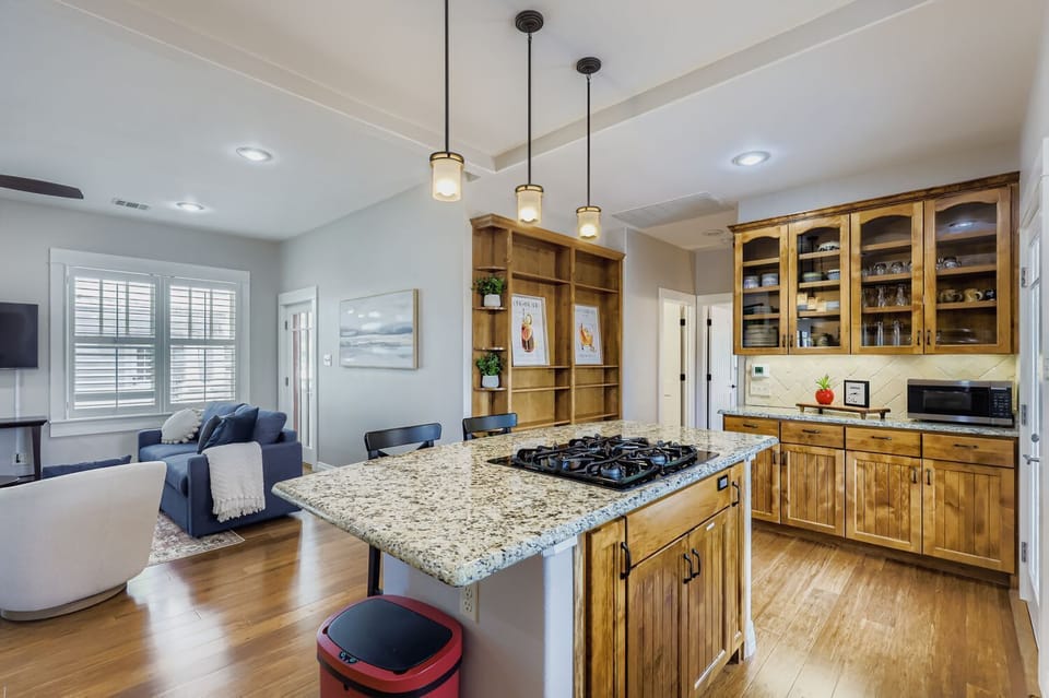 Kitchen and living room combo designed for open-concept entertaining.