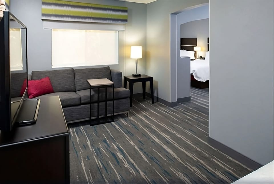 Relax in the lounge area with warm lamp-lit ambiance.