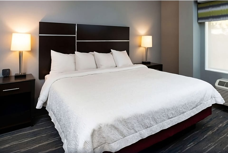 Recharge in a plush bed framed by calming modern design.