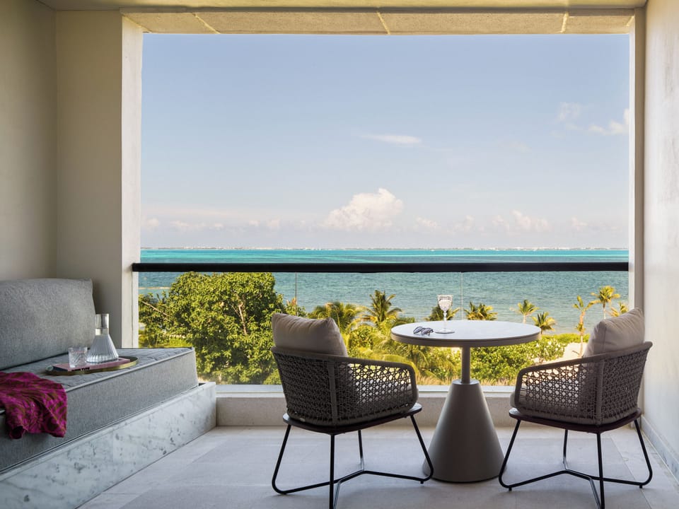 Sip morning coffee on the balcony with sweeping sea views.