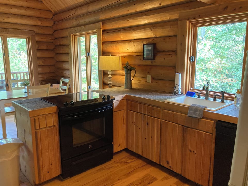 Kitchen: fully stocked with pots, pans, and dishware. 