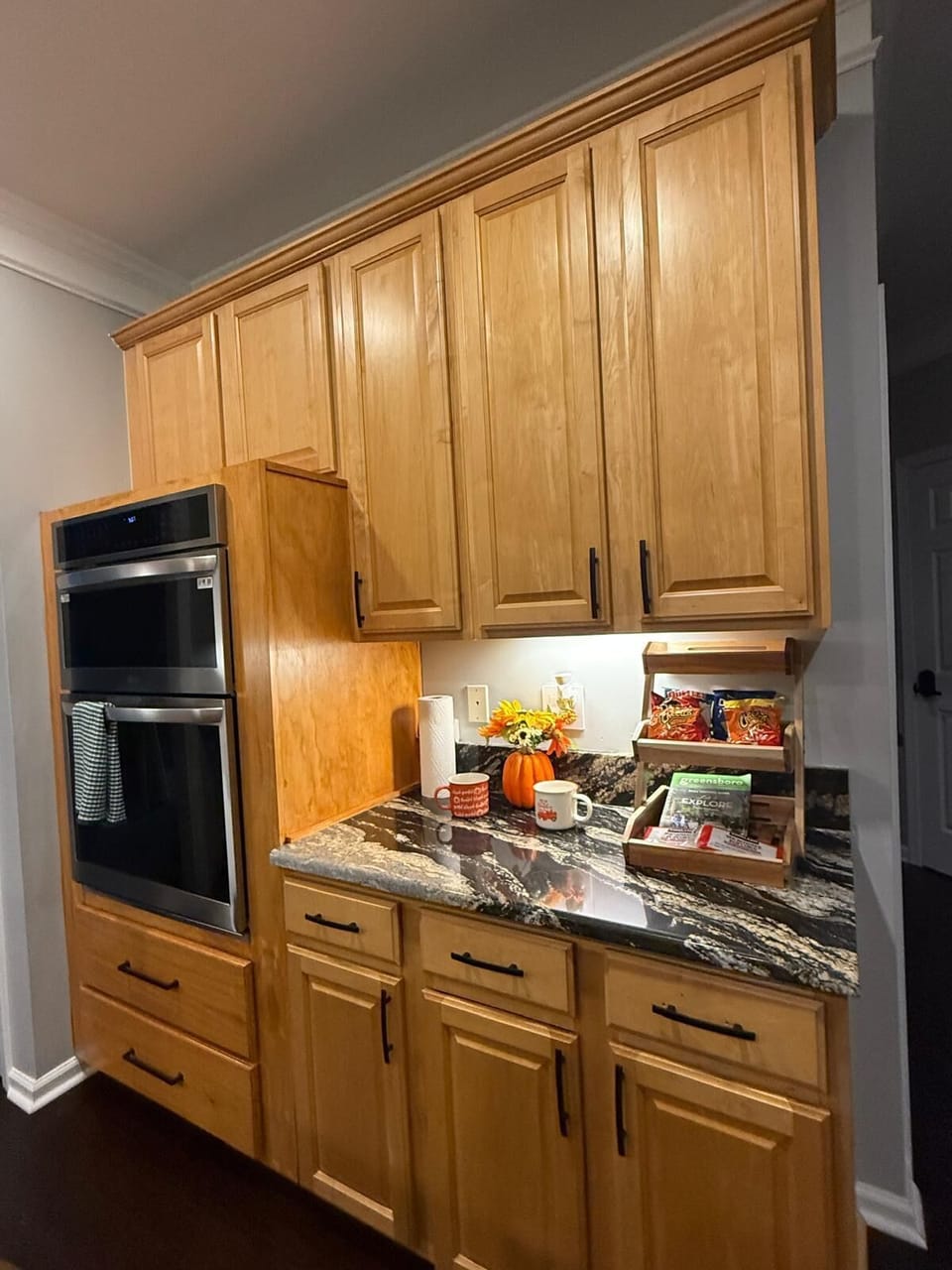 Fully equipped kitchen with modern appliances and cookware.