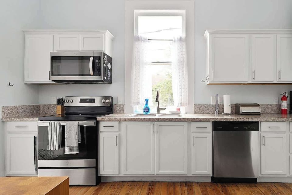 Prep game-day snacks or a quick breakfast in this fully equipped kitchen featuring stainless steel appliances and full-sized oven.