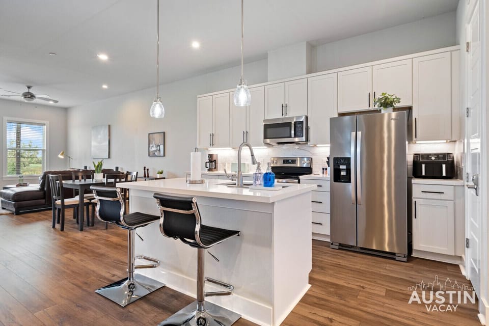 Stocked kitchen with stainless steel appliances.