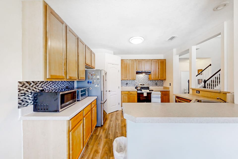 Fully equipped kitchen with appliances—ideal for extended stays and family meals.