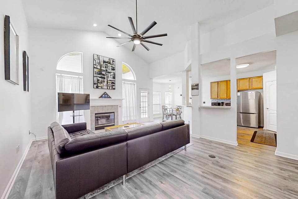 Whether winding down after a day at the beach or gathering for a family movie night, this inviting living space makes it easy to relax.