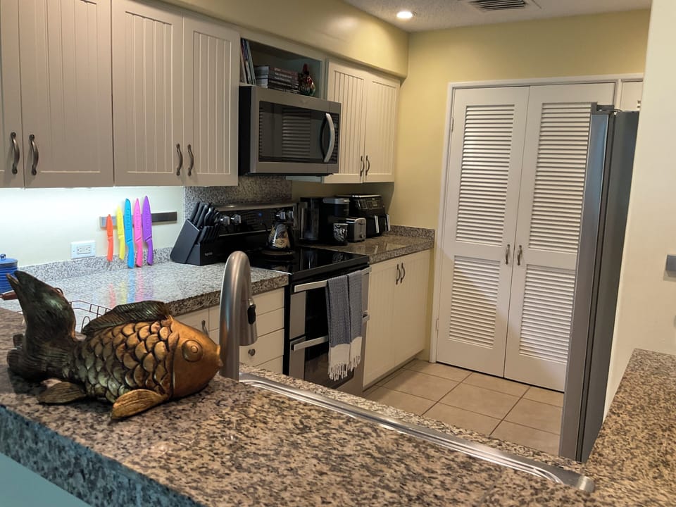 Kitchen has a double oven, microwave, air fryer, Keurig and drip coffee machine.