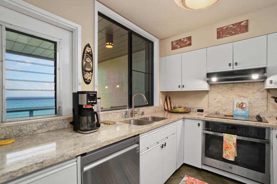 Modern kitchen featuring ocean views and ample counter space.